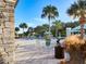 Relaxing pool area with lounge chairs and palm trees at 3832 Shimmering Oaks Dr, Parrish, FL 34219