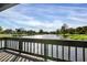 Peaceful lake view from a wooden deck at 3902 Glen Oaks Manor Dr, Sarasota, FL 34232