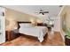 Bright bedroom with king-size bed, tile floors, and ceiling fan at 3902 Glen Oaks Manor Dr, Sarasota, FL 34232