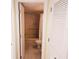 Hallway view of bathroom features a shower/tub combo with neutral tile at 5027 Kestral Park Dr # 64, Sarasota, FL 34231