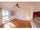Bedroom with built-in shelving, and parquet floors at 5027 Kestral Park Dr # 64, Sarasota, FL 34231