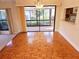 Open concept dining area featuring parquet floors and sliding glass doors to the patio at 5027 Kestral Park Dr # 64, Sarasota, FL 34231