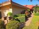 Charming single-story home with manicured landscaping, brick walkway, and mailbox at 5027 Kestral Park Dr # 64, Sarasota, FL 34231