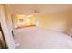 Bright living room featuring a fireplace and carpet at 5027 Kestral Park Dr # 64, Sarasota, FL 34231