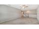 Spacious loft area with carpeted floors at 11741 Brookside Dr, Bradenton, FL 34211