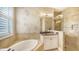 Spa-like bathroom with a soaking tub, walk-in shower, and designer finishes at 12663 Fontana Loop, Bradenton, FL 34211