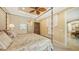 Spacious bedroom with a four-poster bed and ensuite bathroom at 12663 Fontana Loop, Bradenton, FL 34211