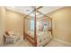 Cozy bedroom with canopy bed and wicker chair at 12663 Fontana Loop, Bradenton, FL 34211