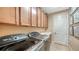 Bright laundry room with ample cabinetry and modern appliances at 12663 Fontana Loop, Bradenton, FL 34211