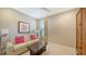 Cozy sitting room featuring a light beige sofa and wooden coffee table at 12663 Fontana Loop, Bradenton, FL 34211