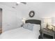 Cozy guest bedroom with window and decorative mirror at 10646 Spring Tide Way, Parrish, FL 34219