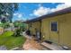 Private backyard with exterior door access and landscaped area at 251 Plantation Rd, Venice, FL 34293