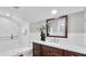 Elegant bathroom with a walk-in shower, modern vanity, and marble tile at 3101 Riverview Blvd, Bradenton, FL 34205