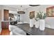 Elegant dining room with a dark wood table and modern chandelier at 3101 Riverview Blvd, Bradenton, FL 34205