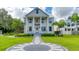 Two-story house with a charming front porch and landscaped yard at 3101 Riverview Blvd, Bradenton, FL 34205