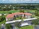 Aerial view of condo community near golf course with covered parking at 6503 Stone River Rd # 302, Bradenton, FL 34203