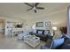 Open concept living and dining area with comfortable seating at 6515 Grand Estuary Trl # 105, Bradenton, FL 34212