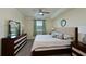 Spacious Primary bedroom with king-size bed and ample dresser space at 6515 Grand Estuary Trl # 105, Bradenton, FL 34212