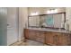 Elegant bathroom with double vanity and granite countertop at 14717 Leopard Creek Pl, Lakewood Ranch, FL 34202