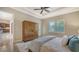 Relaxing bedroom with neutral decor and plenty of closet space at 14717 Leopard Creek Pl, Lakewood Ranch, FL 34202