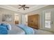 Spacious bedroom with ensuite bathroom access and large closet at 14717 Leopard Creek Pl, Lakewood Ranch, FL 34202