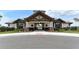 Community clubhouse entrance with landscaping at 14717 Leopard Creek Pl, Lakewood Ranch, FL 34202