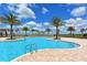 Relaxing pool area with palm trees and lounge chairs at 14717 Leopard Creek Pl, Lakewood Ranch, FL 34202