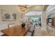 Open concept dining room with view into living room and kitchen at 14717 Leopard Creek Pl, Lakewood Ranch, FL 34202