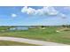 Stunning view of the championship golf course and serene lake at 14717 Leopard Creek Pl, Lakewood Ranch, FL 34202