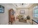 Cozy home office features built-in shelving and a comfortable sitting area at 14717 Leopard Creek Pl, Lakewood Ranch, FL 34202