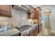 Modern kitchen with gas cooktop and custom cabinetry at 14717 Leopard Creek Pl, Lakewood Ranch, FL 34202