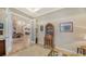 Home office with built-in shelving and hardwood floors at 14717 Leopard Creek Pl, Lakewood Ranch, FL 34202