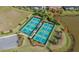 Aerial view of well-maintained pickleball and tennis courts at 14717 Leopard Creek Pl, Lakewood Ranch, FL 34202