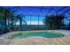 Screened-in pool and spa overlooking a golf course at 14717 Leopard Creek Pl, Lakewood Ranch, FL 34202