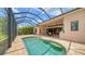 Inviting screened pool and patio area with outdoor kitchen at 14717 Leopard Creek Pl, Lakewood Ranch, FL 34202