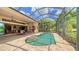 Relaxing screened pool and patio with outdoor kitchen and dining at 14717 Leopard Creek Pl, Lakewood Ranch, FL 34202