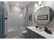 Well-lit bathroom with a shower and tub combination, modern fixtures, and ample counter space at 5510 Panella Ct, Palmetto, FL 34221