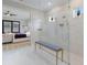 Modern bathroom with a large glass-enclosed shower, bench, and neutral color palette at 5510 Panella Ct, Palmetto, FL 34221