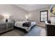 Comfortable bedroom with neutral colors, a window with plantation shutters, and stylish furnishings at 5510 Panella Ct, Palmetto, FL 34221