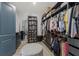 Walk-in closet with custom shelving, drawers, and ample storage space for an organized wardrobe at 5510 Panella Ct, Palmetto, FL 34221