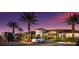 Amenity center at twilight with palm trees, offering a glimpse of community activities and services at 5510 Panella Ct, Palmetto, FL 34221