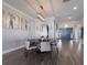 Open dining room features modern lighting and an elegant decor; perfect for gatherings at 5510 Panella Ct, Palmetto, FL 34221