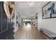 Spacious foyer with hardwood floors, a decorative chandelier, and an open view to the living area at 5510 Panella Ct, Palmetto, FL 34221
