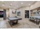 Inviting game room featuring a pool table, TV, and reading nook with natural light at 5510 Panella Ct, Palmetto, FL 34221