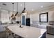 Bright kitchen featuring a large island, pendant lights, and stainless steel appliances at 5510 Panella Ct, Palmetto, FL 34221