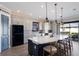 Open kitchen features large island with bar seating, modern stainless steel appliances, and lots of cabinets at 5510 Panella Ct, Palmetto, FL 34221
