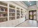 Well-stocked library with built-in bookshelves, providing a quiet space for reading and relaxation at 5510 Panella Ct, Palmetto, FL 34221