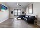 Cozy living room with stylish decor, hardwood floors, and modern lighting fixtures at 5510 Panella Ct, Palmetto, FL 34221
