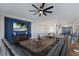 Spacious living room featuring a large sofa, hardwood floors, and an entertainment center at 5510 Panella Ct, Palmetto, FL 34221