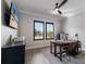 Functional home office featuring a desk, computer setup, and abundant natural light through plantation shutters at 5510 Panella Ct, Palmetto, FL 34221
